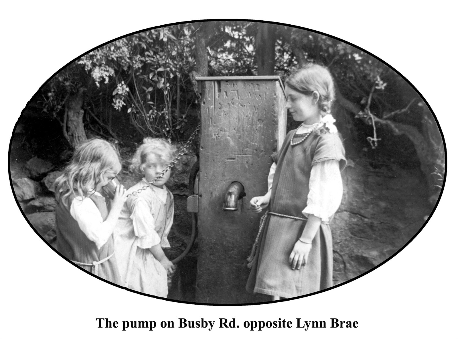 Girls at the water pump in Busby Rd.